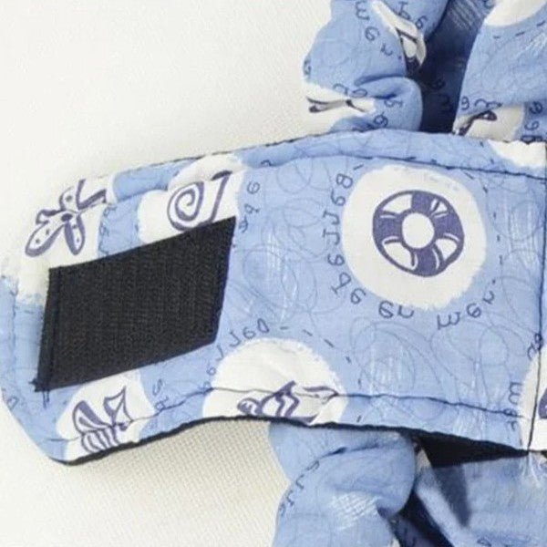 Ceinture sécuritaire à velcro dans l'echarpe de portage.