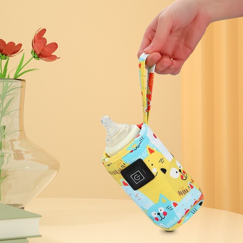 Chauffe biberon portable aux motifs chats jaunes.