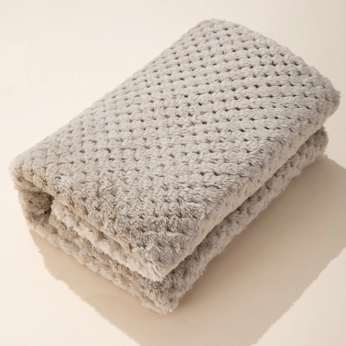 Couverture bebe polaire grise pliée