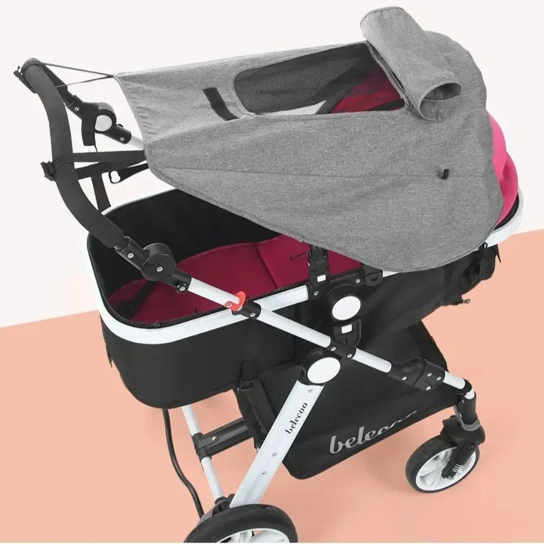 Pare-soleil installé sur landau poussette