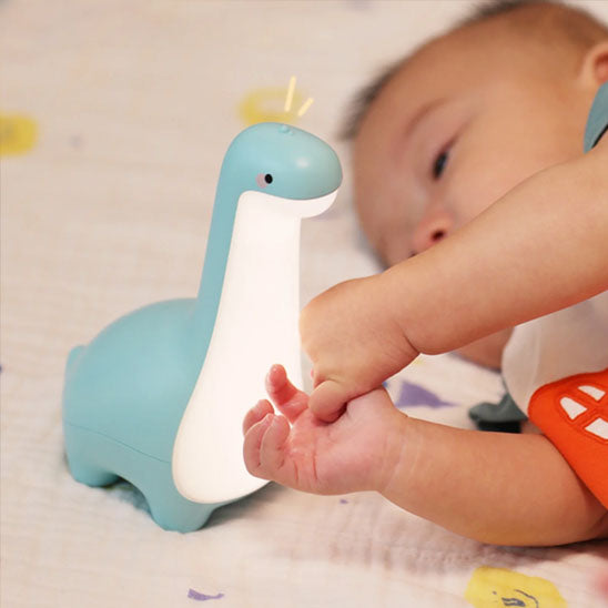 Petite veilleuse dinosaure bleue avec bébé