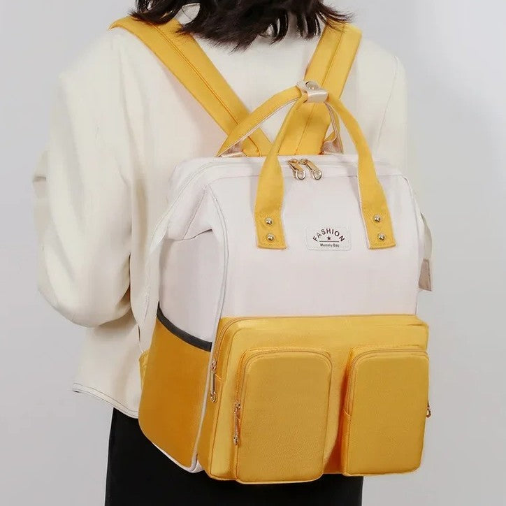 Sac a langer jaune multifonctions.