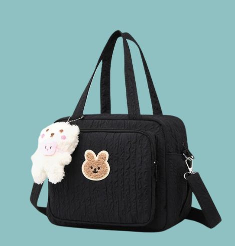 Sac à langer ourson compact noir.