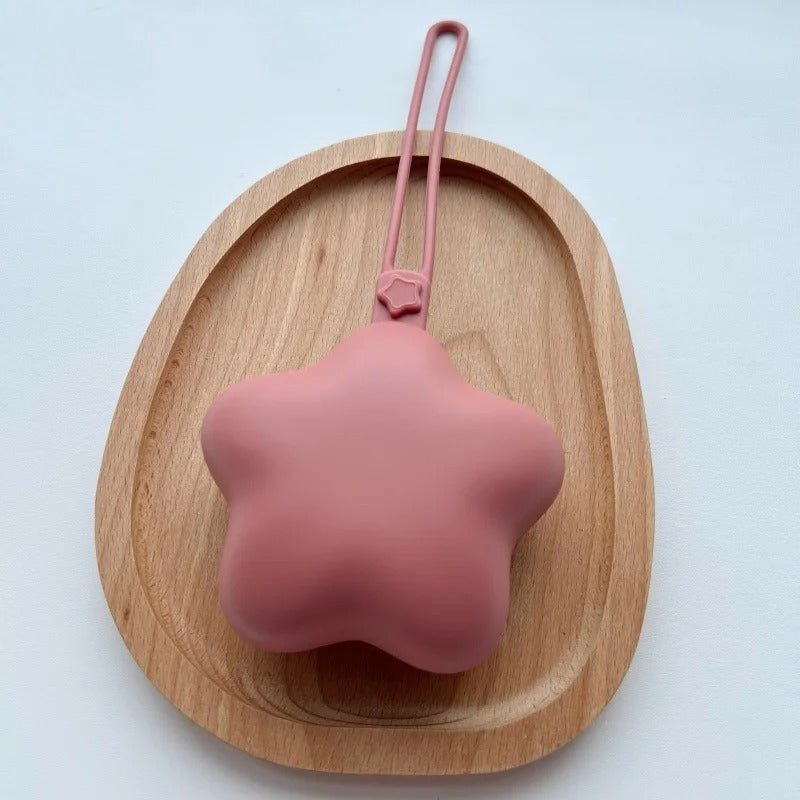 Boite a tetine étoile rose en silicone.
