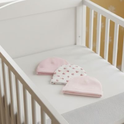 Bonnet bébé fille rose en coton bio pour nouveau-né.
