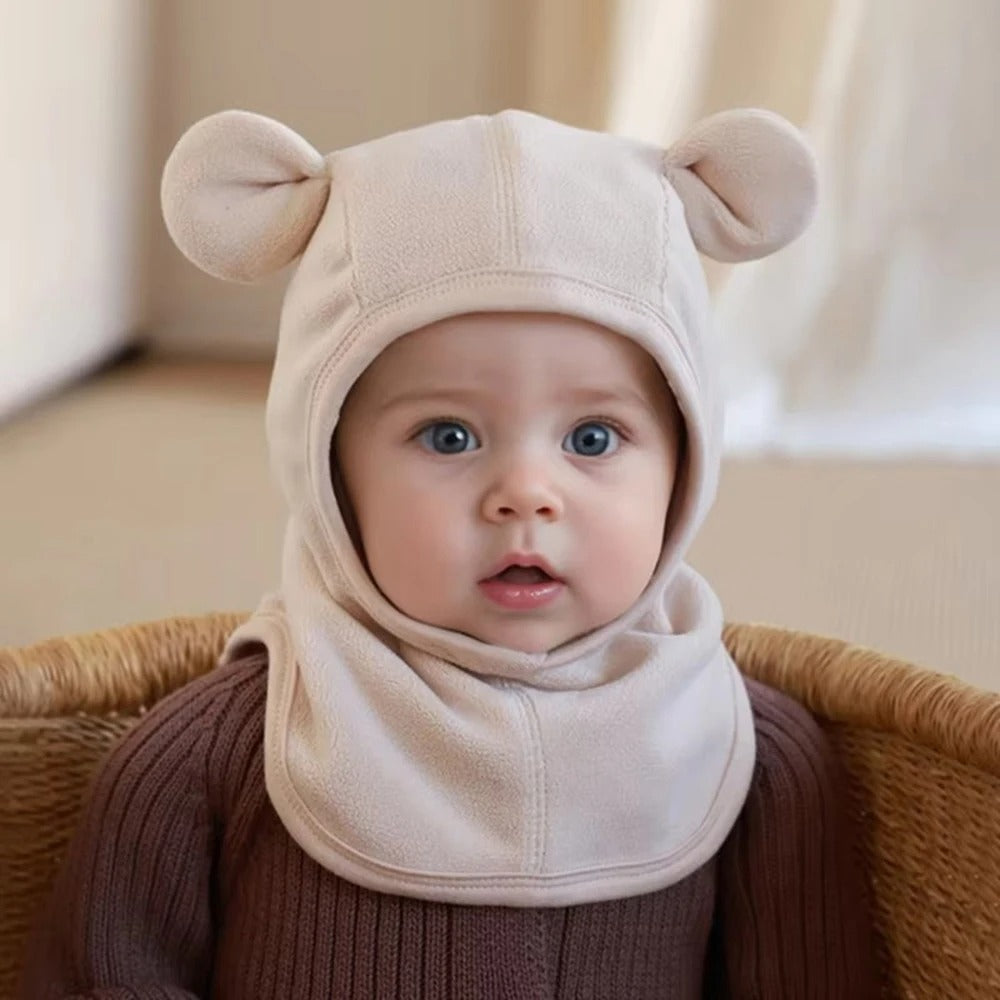 Cagoule bebe en polaire beige pâle.