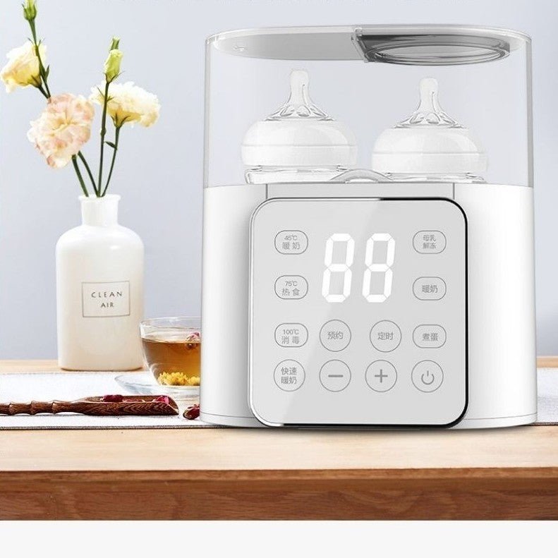 Chauffe biberon sur table avec miel fleurs