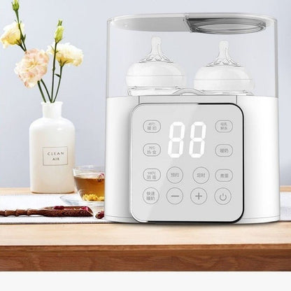 Chauffe biberon sur table avec miel fleurs