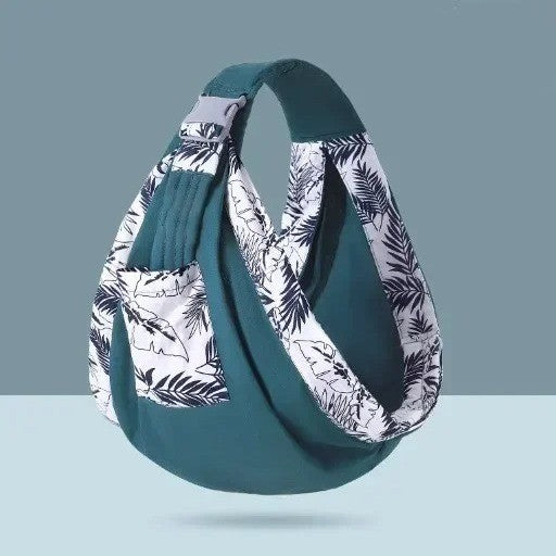 Echarpe de portage en coton turquoise et motifs floraux.