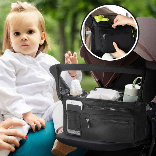 Fillette et sac a langer bebe installé sur poussette