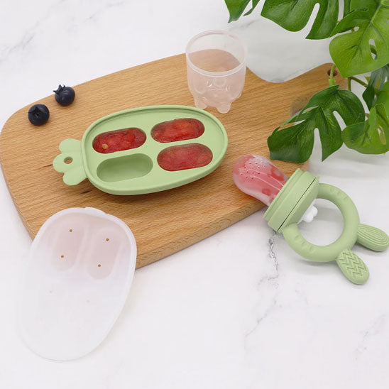 Grignoteuse bebe verte avec moule pour la congélation.