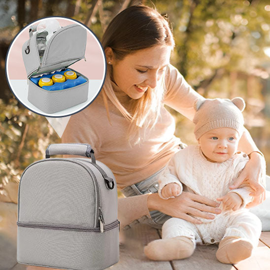 Maman et bébé au parc avec sac bebe isotherme
