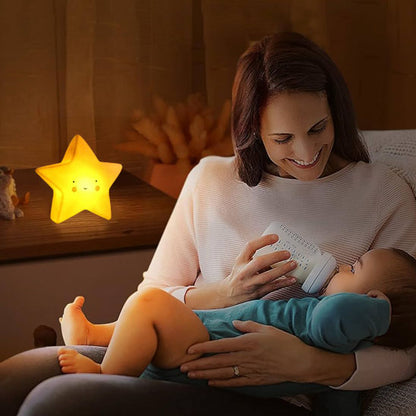 Maman nourrissant son bébé avec veilleuse bébé étoile