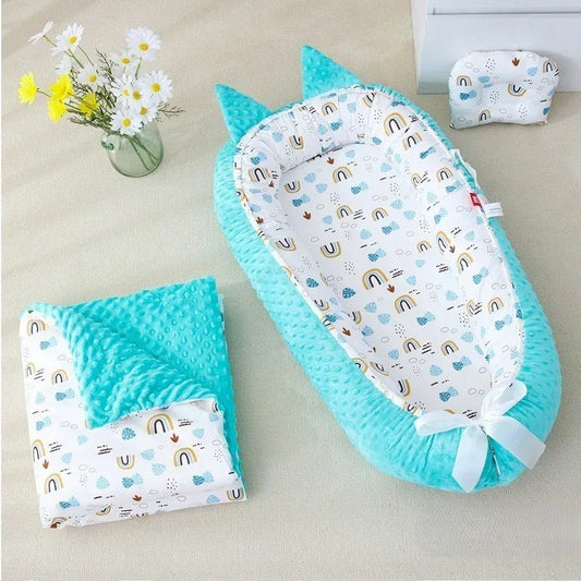 Nid d'ange en coton turquoise et couverture.