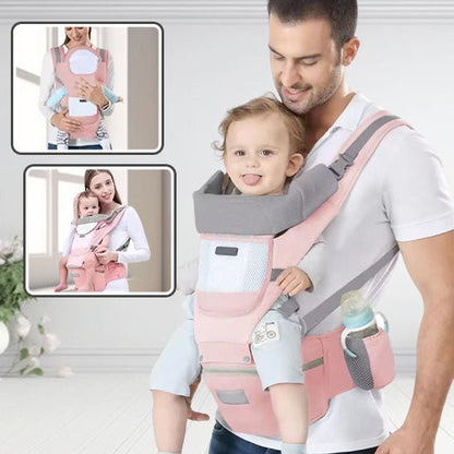 Papa transportant bébé dans porte bebe évolutif rose