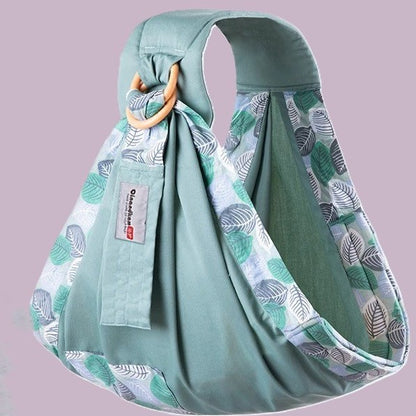Porte bebe vert aux motifs feuilles.