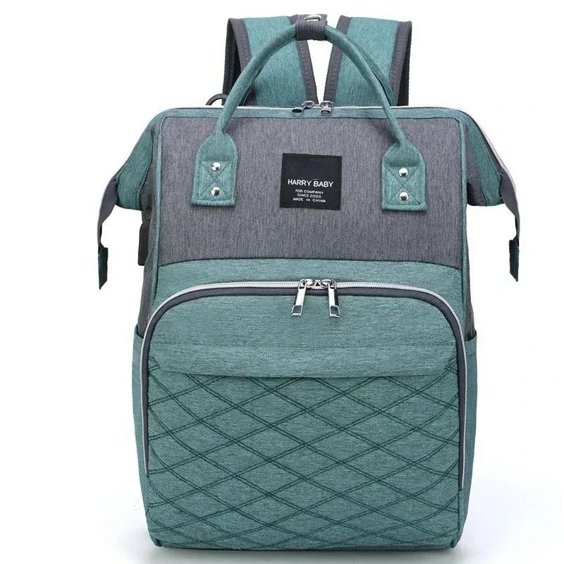 Sac à langer multifonctions vert et gris.