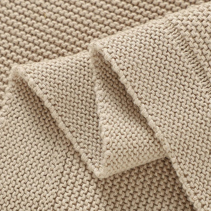 Tissu en tricot d'une couverture bébé vu de prêt. 